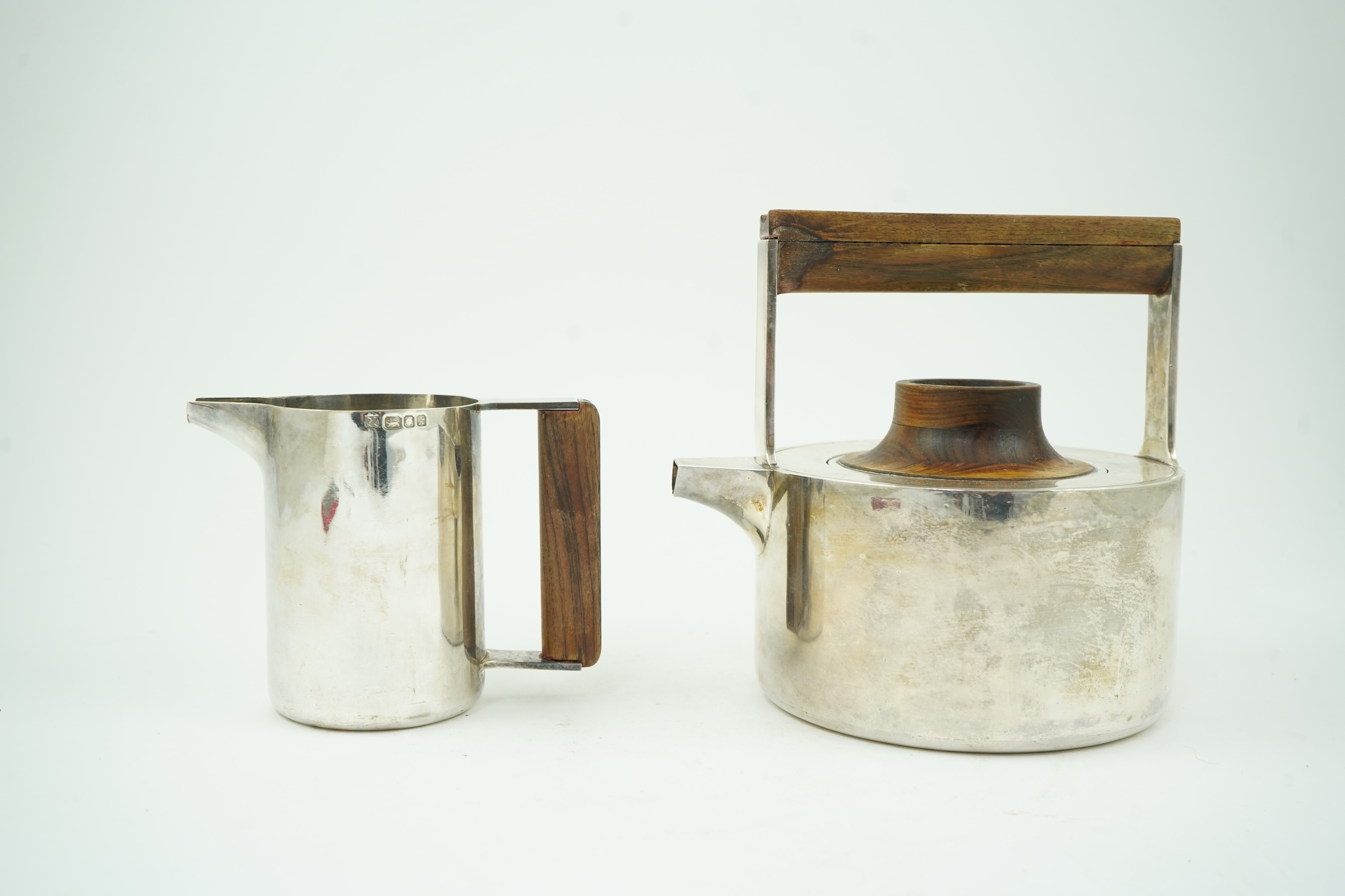 Roy Ridsdale (1942-2020): A silver tea kettle and matching cream jug